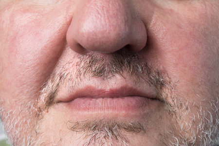Man with natural grown moustache and facial hair for november cancer awareness month.