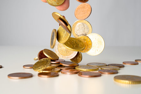 Euro coins falling on a heap. Money raining from the sky above abstract concept.の写真素材