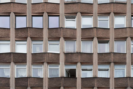 Old residential building facade with one window open. Architectural backgroundの写真素材