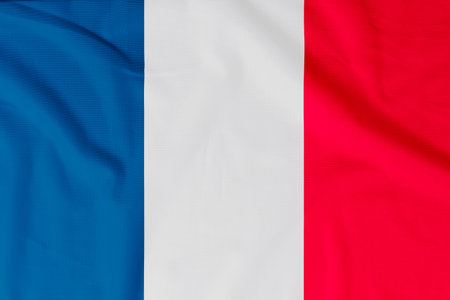 Flag of France (French Republic) with natural material creases as a background