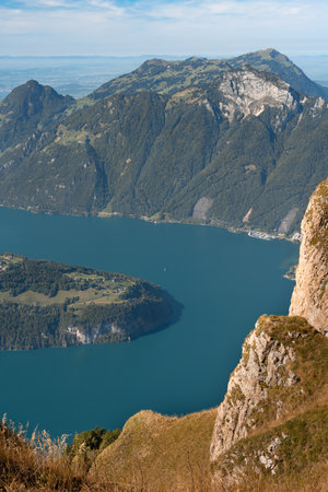 Lake in a valley seen from Fronalpstock summit in Switzerland. Swiss Alps iconic viewの写真素材