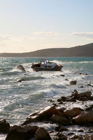 Photo of the  boat stranded on rocksの写真素材