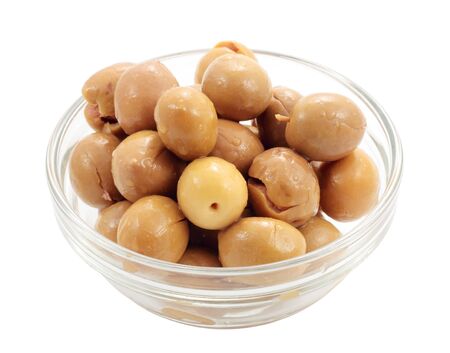 appetizer of seasoned olives in a bowl of cut glass and isolatedの写真素材