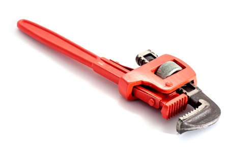 adjustable spanner colored red for plumbing isolated on fund in horizontalの写真素材