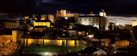 panoramic view of the old part of the city of CÃ¡ceres at nightの写真素材