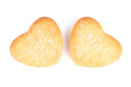 rotated two cookies shaped heart for valentines day isolated on whiteの写真素材