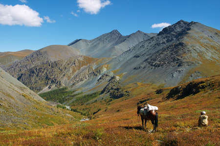 Men, horse and mountains. Altayの写真素材