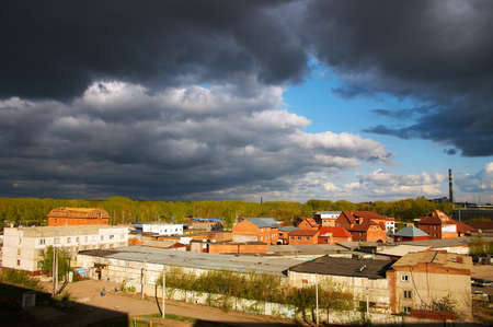 city under black cloudsの写真素材