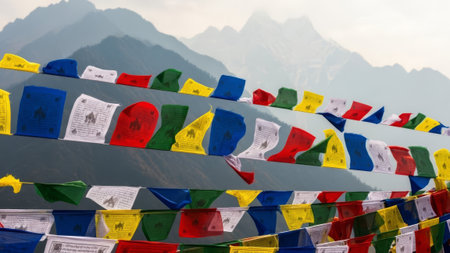 Colorful prayer flags in mountains, Buddhist symbols, spirituality, culture.の素材