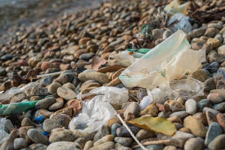 Garbage plastics on the rock beachの写真素材