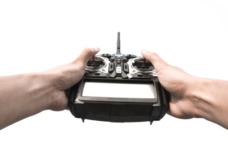 Radio remote control in hand isolated on white