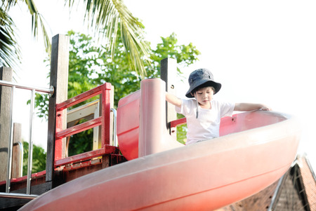 Happy child on playgroundの写真素材