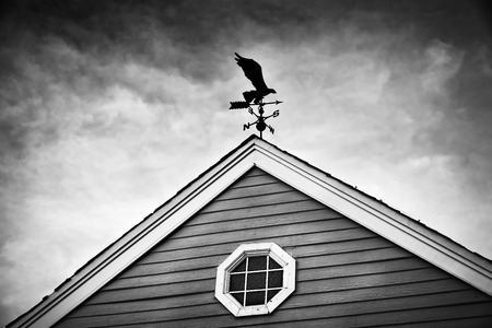 Direction wind turbine on roofの写真素材