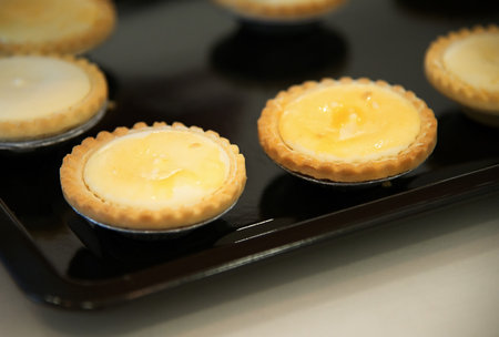 Egg tart on black plate : close upの写真素材