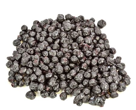 A pile of dried blueberries on a white background.の写真素材