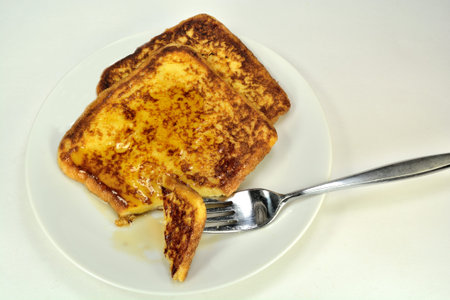 Slices of french toast on a white background.