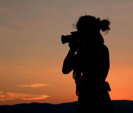 photographer woman silhouetteの写真素材