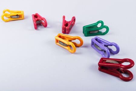 clothespins for drying clothes. multi-colored clothespins are matte. eye-pleasing shades of color. composition on the backgroundの写真素材