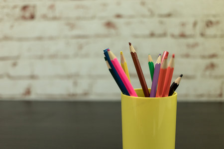 a few colored pencils. pencils of different colors. colored pencils stand in a cup. The background...