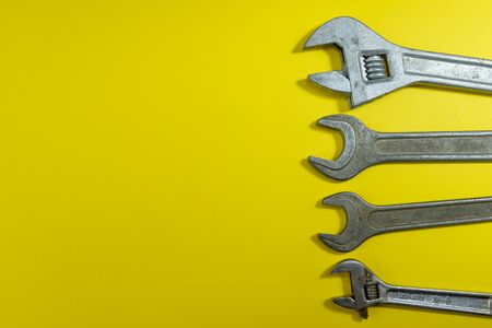 working tools. wrench for housework. colored background. tools for the house. steel reliable wand keys on a colored background. tools for manual workerの写真素材
