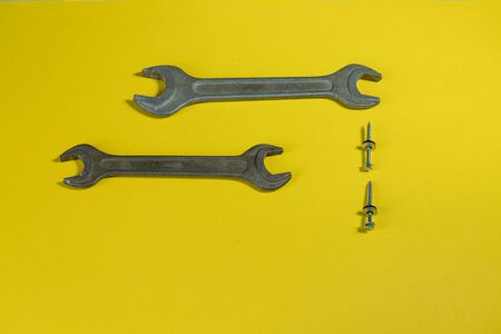 working tools. wrench for housework. colored background. tools for the house. steel reliable wand keys on a colored background. tools for manual workerの写真素材
