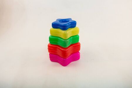childrens bright colorful toys on a white background. stars piramidの写真素材