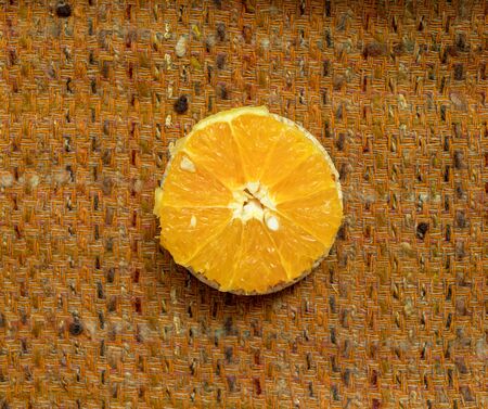 vegetarian sandwich. on grain loaves lie. repeating the shape of the circle vegetable and fruit, olives, sorrel. it harmonizes with a warm textured dark orange backgroundの写真素材