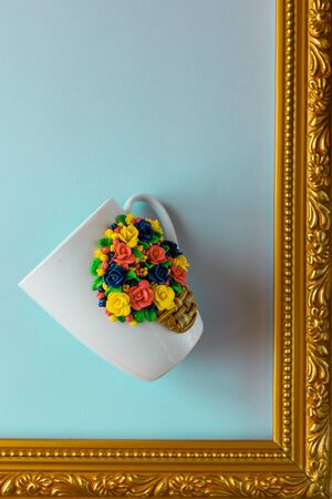 The original mug with decorative figurines made with their own hands. A lovely birthday present. Figures on the cup are fashioned hand made from colored clay. Stand in golden frame. High quality photoの写真素材