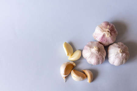 garlic lies on a gray background. Photographed at close range. . High quality photoの写真素材