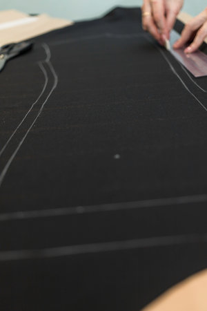 Fabric ready-made suit textile shades in the workplace, tailor or tailor, close view, atelierの写真素材