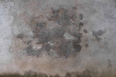 Abstract grunge texture of old colorful wall with cloud pattern. Creative background. Gray, orange, pink and brown beautiful rough weathered stone texture. Copy spaceの写真素材