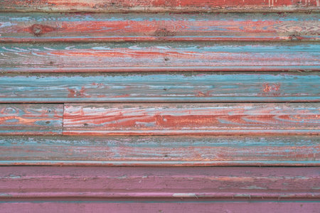 Beautiful colorful blue, pink and orange old wooden texture background. Scratched weathered wooden...