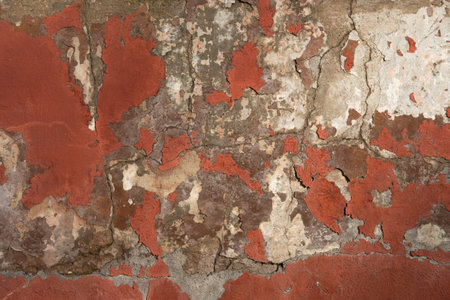 Abstract grunge texture of old red wall with peeled off paint. Creative background. Gray, red, white...
