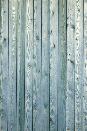 Green wooden texture background. Beautiful new bright wall surface. Vertical wooden boards. Close up with copy spaceの写真素材