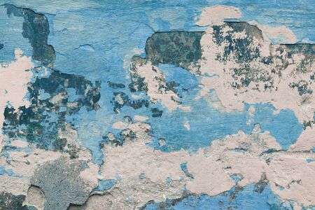 Abstract texture of old colorful blue wall with grain and scratches. Beautiful, artistic, creative background. White, gray and blue rough weathered stone texture. Copy spaceの写真素材