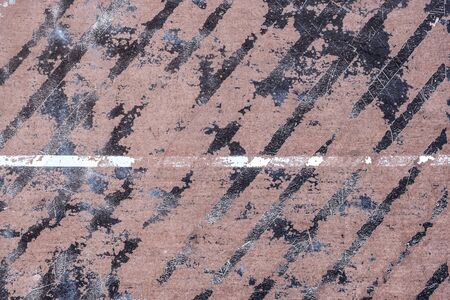 Abstract striped purple and gray background. Old, weathered table tennis table texture with black and white lines and scratched off material. Close up, copy spaceの写真素材