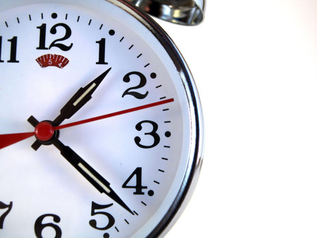 Old bracket clock with a red arrow.