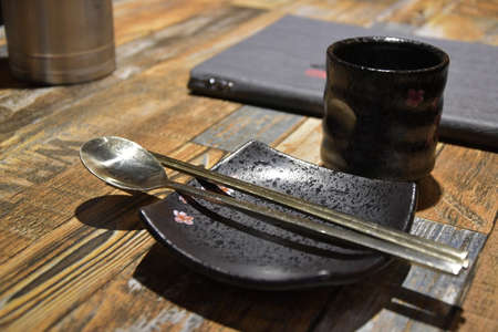 Table setting with black ceramicの写真素材