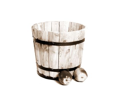 Sepia colored old wooden barrel and some applesの写真素材