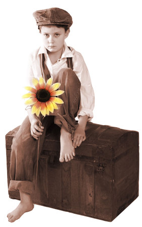 A child looking sad for his vintage portrait.の写真素材