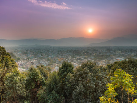 a foggy day sun set pokhara town view from Matepani Gumba