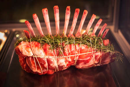 Raw fresh uncooked Pork Meat steak on bone, Raw pork Meat steak on steel trayの写真素材
