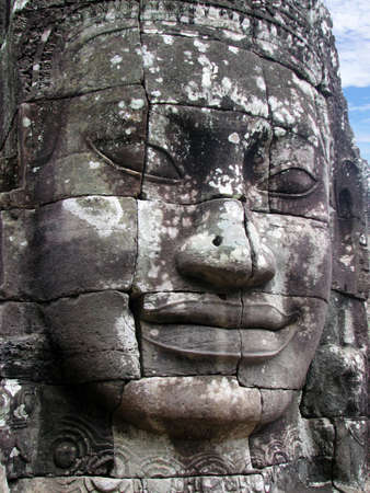 Smiling buddha face of Bayon at Angkor, Cambodiaの写真素材