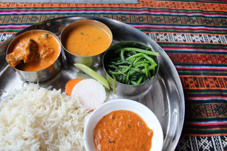 Typical Nepalese Meal, Thali with a bowl of yogurt in the restaurant at Lhasa, Tibet, China