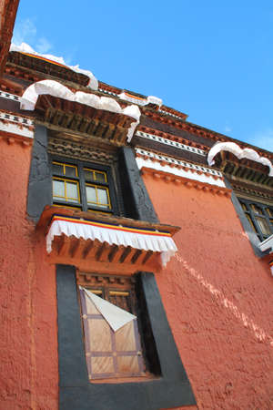Tibetan building with windows in the Tashilhunpo monastery, Shigatse, Tibetの写真素材