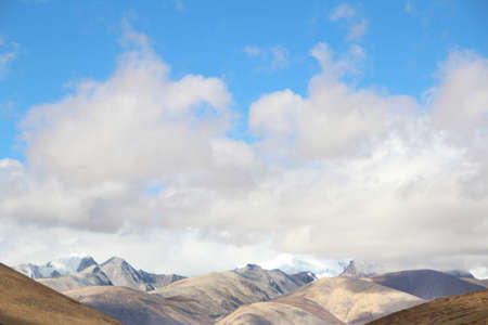 View of the mountains and dramatic sky on the way to Everest Base Camp, Tibet, Chinaの写真素材
