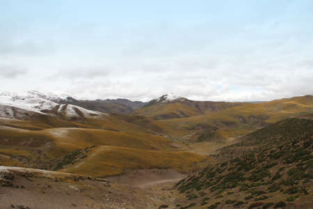 View of mountains with the snow on peak in Tibet, Chinaの写真素材
