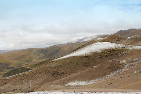 View of mountains with the snow on peak in Tibet, Chinaの写真素材