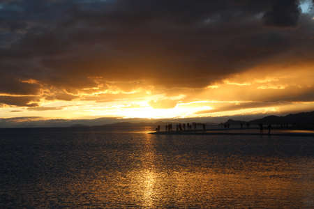 View of the sunset at Namtso lake with dramatic sky, Tibet, Chinaの写真素材