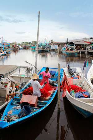 The fishermans are tidy up the fishing net in Fishing Village Sekinchan.のeditorial素材